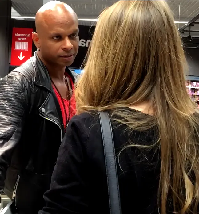 Deepak speaking with a woman in a real-life social setting
